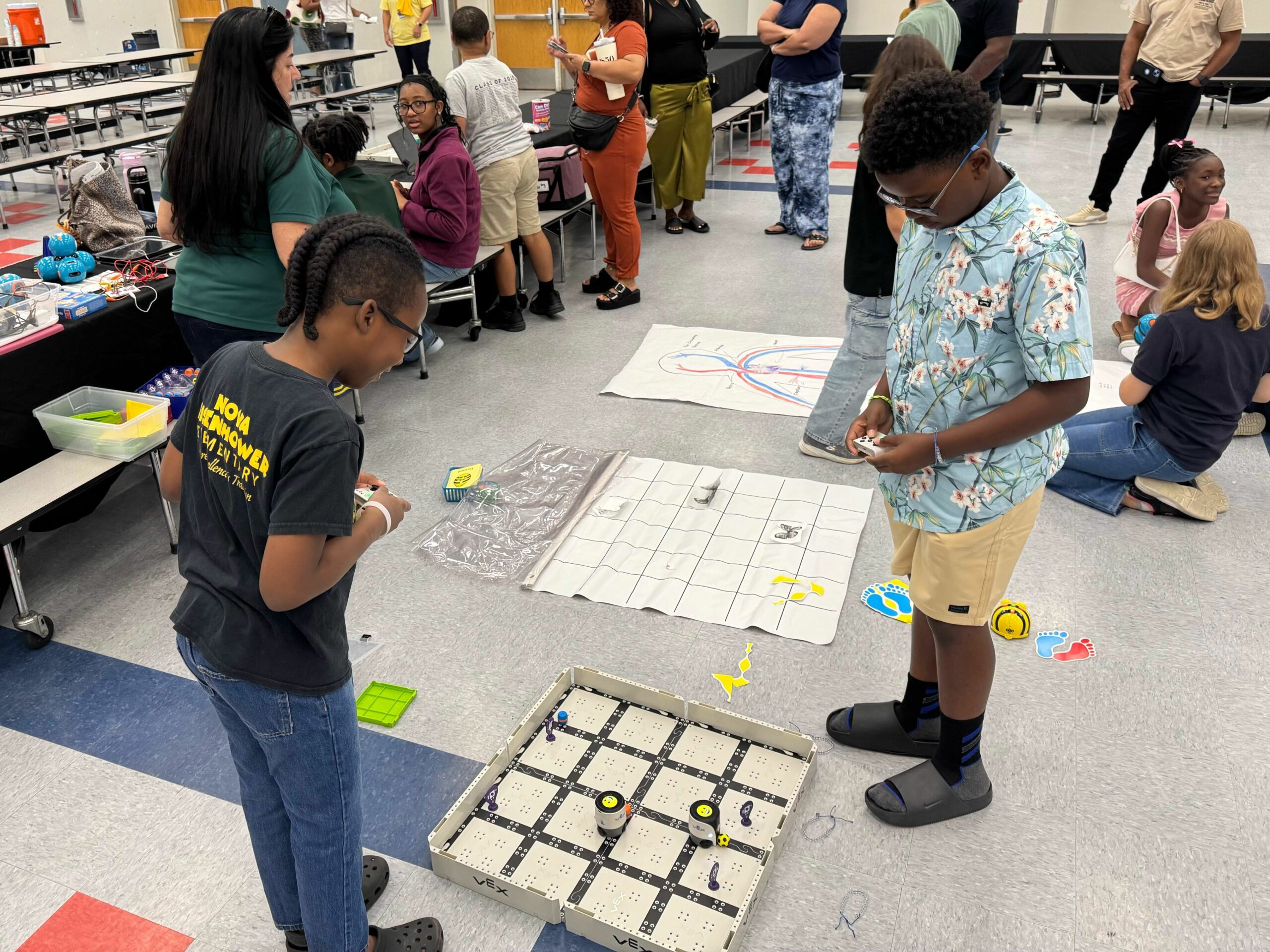 Kids using vex robot to learn about computer science.