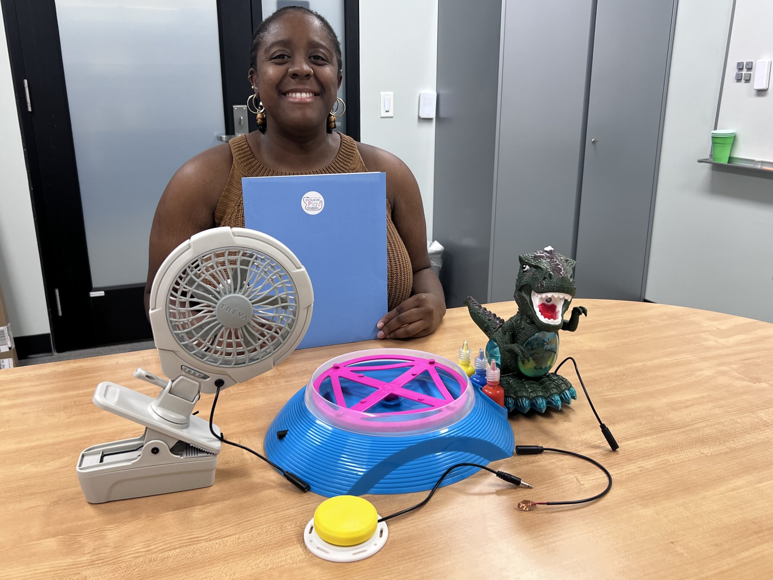 nykema Nykema Lindsey at a desk with components to build an adaptive toy.